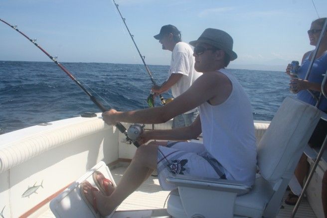 Hector and Carlos welcomed us aboard early and you could tell they were all about getting out early. A short while after we passed all other boats, you could tell we were headed to special waters with a special boat (I had picked “Cabo Magic” after doing a very brief amount of research and seeing that their boat placed in the Top Ten at the annual Bisbee’s tournament). Literally within 5 minutes (I kid you not….5 minutes) of putting our lines into the water, we had a striped marlin AND a sailfish ‘double-header’ on our lines. We completed the double header and truly thought our day was done, but thereafter we caught not 1, not 2 but four more striped marlin that day. FIVE striped marlin and a sailfish is a trophy day by anyone’s count and we could not believe how lucky we were – every single person caught a big game fish. The sun was hot, the ocean choppy, the burritos were delicious, the beer was cold and Hector and Carlos delivered up one AMAZING fishing trip. I can’t say this was a trip of a lifetime because I expect just as much next time I fish with them, as I’m definitely coming back for more. THANK YOU CABO MAGIC!! Lori, you are a fantastic planner and Tommy it was a pleasure to meet you on the dock. Cheers – Miller, Nick, Kevin, Laura, Kellen and Tony – Ypsilanti, Michigan