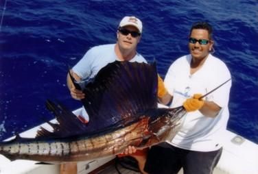 Kevin and I had a great experience fishing aboard “Cabo Magic” with Capt Hector and ChaCha. That morning as we headed out I saw the lures being prepared for us and Kevin said to me “These guys are all business” Within the next hour we landed a 180lb Striped Marlin. Soon after the Capt put us on Dorado one after the other. The crew worked well together and next thing I know we reel in Two Sailifish back to back. I reeled in another Dorado and Kevin gets one more Sailfish. To finish off a perfect day I get a big bull Dorado. We’ll never forget fishing with Capt Hector and ChaCha. They were courteous, and made the effort to show us the best time possible. “Cabo Magic” had the best display of flags on the outriggers that day. Hope you enjoy the pictures