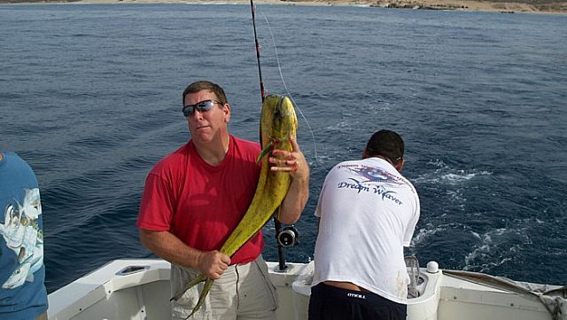 Here is Larry with his feisty Durado that wanted to get back in thewater. Dan