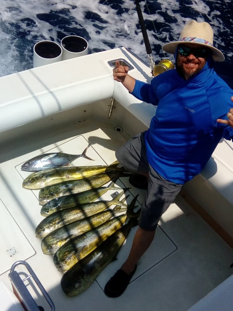 Sportfisher Capt Chito at the helm with very happy guests aboard!