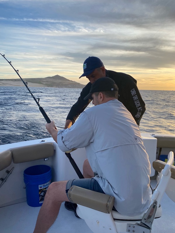 Lalo teaching VIP guest Mark Thiesen the “how-to” of sportfishing.
